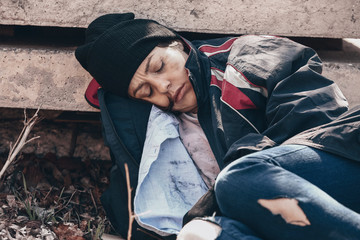 Poor homeless woman outdoors