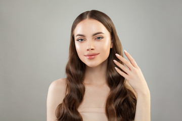 Perfect woman with long healthy hair, clear skin and hand with manicured nails. Skin care and hair care concept