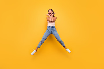 Fototapeta na wymiar Full length body size view photo impressed astonished teen trendy summer incredible information discount place palms face scream shout carefree childish beautiful clothes isolated yellow background