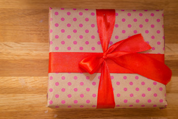 a gift with a red ribbon
