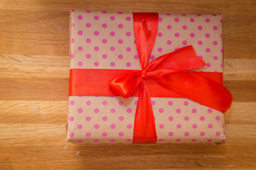 a gift with a red ribbon