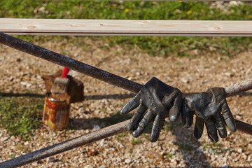 Used work gloves and paintbrush.Construction concept.