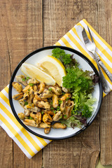 Peeled mussels with fresh lemom. Healthy seafood, natural sunlight, wooden rustic table.