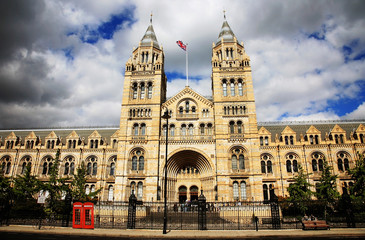 Fototapeta premium Outside view of Natural History Museum over dramatic blue cloudy sky.
