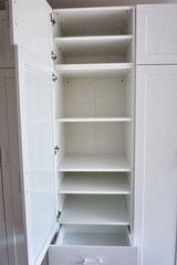 Fototapeta premium Internal details of the wardrobe. Large wardrobe. Details and close-up.