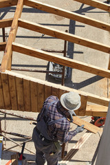 Worker during the construction.Closeup view.