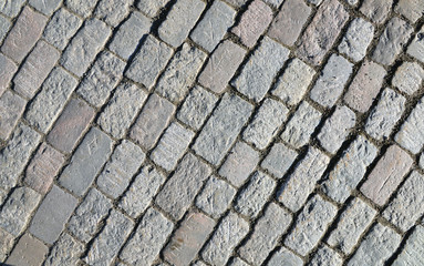 Old cobblestone pavement close-up.