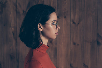 Profile side view photo of focused banker  freelancer have eyewear eyeglasses wavy curly hair hairstyle dressed stylish style trendy red clothing interior