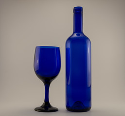 blue bottle and single wine glass on a white back ground