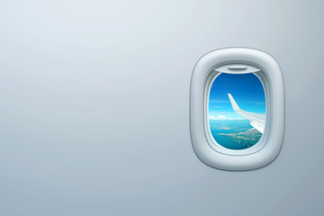Airplane window with view of sea coast and place for text
