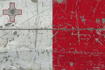 Grunge Malta flag on old scratched wooden surface. National vintage background.