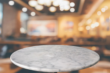 round marble table top with cafe restaurant bokeh lights abstract background for montage product...