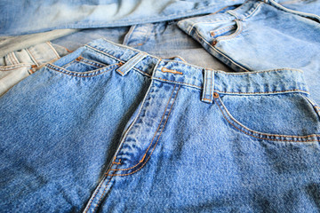 many denim blue jeans background