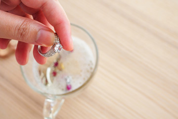 Jeweller hand cleaning vintage jewelry diamond ring closeup