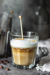 cappuccino coffee in a glass cup on the table