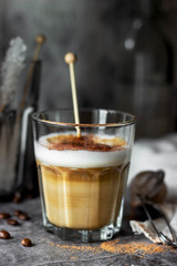 cappuccino coffee in a glass cup on the table