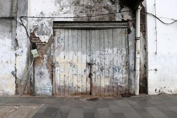 Background of wooden doors and old walls.