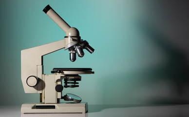 microscope lenses close up on green background