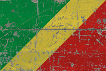 Grunge Republic Of The Congo flag on old scratched wooden surface. National vintage background.