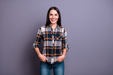 Portrait of attractive youngster education learning person place palms hands pockets jeans have long haircut hairdo wear plaid outfit modern feel glad isolated on grey background