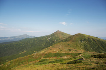 landscape with green mountains and clouds