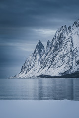Sharp mountains range in winter blue hour