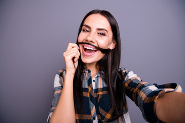 Portrait cute careless childish carefree stylish teen teenager  satisfied content make photos blog relax rest weekend free time make faces plaid fashionable shirt checked isolated on grey background