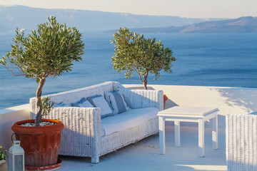 Fototapeta na wymiar Terrace lounge with olives tree and sea view. Vacation and holiday concept
