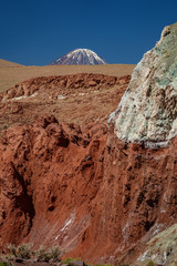 Licancabur volcano mountain peak over Rainbow valley