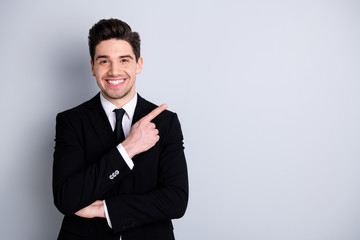 Close up photo amazing he him his macho attractive handsome hand arm index finger direct indicate empty space news wear white shirt black suit jacket tie formal-wear isolated bright grey background