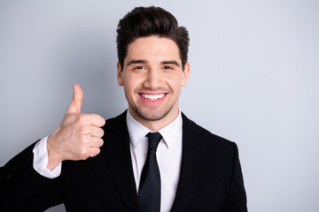 Close up photo amazing he him his macho handsome hand arm thumb up advising buy buyer new tested great product wear white shirt black suit jacket tie formal-wear isolated bright grey background