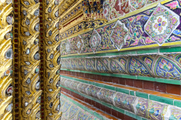 BANGKOK, THAILAND - August 25, 2016: Close up of the beauitful mosaic tilesin Wat Pho or Wat Phra...