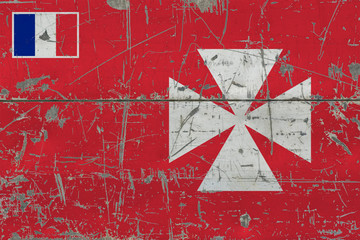 Grunge Wallis And Futuna flag on old scratched wooden surface. National vintage background.