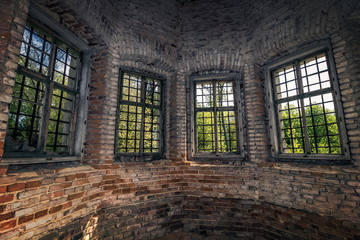 Fototapeta na wymiar four windows in a tower of an old castle