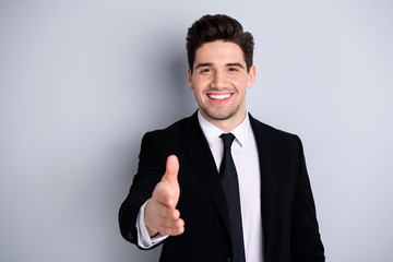 Close up photo of glad content charming youngster investor investment have meeting greet hand feel enjoy partner partnership concept he his black jacket isolated on silver background 