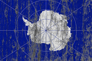 Flag of Antarctica painted on worn out wooden texture background.