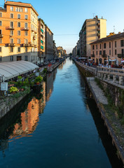 Fototapeta na wymiar Naviglio grand canal, Milan, Italy. Navigli were a system of navigable and interconnected canals around Milan. Today, the Naviglio Grande and the Naviglio Pavese are a nightlife pole