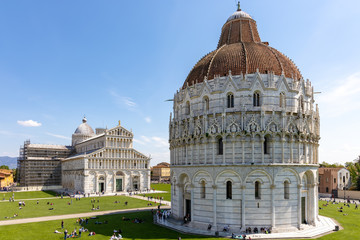 PISA, TUSCANY/ITALY  - APRIL 18 : Exterior view of the Baptistery in Pisa Tuscany Italy on April 18, 2019. Unidentified people