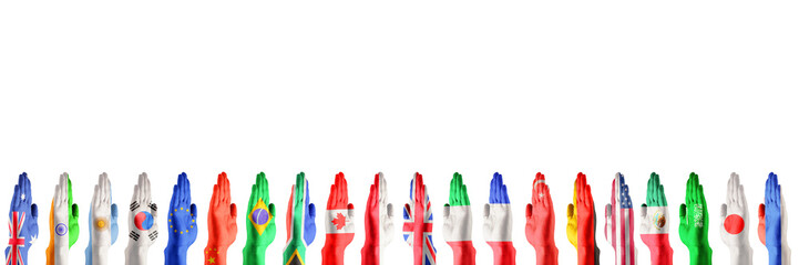 Hands colored in flags of participating countries of The Group of Twenty, major advanced and emerging economies on white background. Collage. International economical relationships. Copy space.