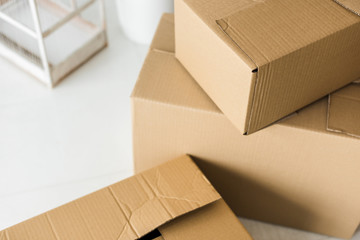 Brown cardboard boxes on light surface at home