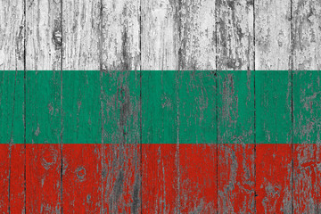 Flag of Bulgaria painted on worn out wooden texture background.