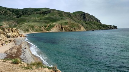 Obraz premium sea ​​coast and green cape