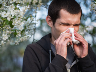 Springtime allergies and flu. The man with the handkerchief