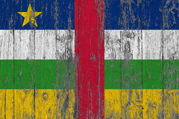 Flag of Central African Republic painted on worn out wooden texture background.