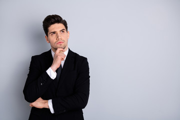 Close up photo amazing he him his macho handsome look up empty space arm touch chin deep thinking minded make decision doubtful wear specs shirt suit jacket tie formalwear isolated grey background