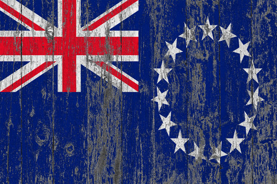 Flag Of Cook Islands Painted On Worn Out Wooden Texture Background.