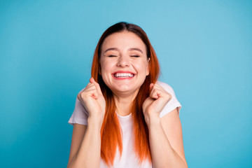 Portrait of cute funny funky teen teenager raise fists close eyes interested plead wait expect want...