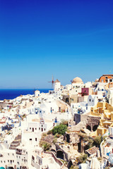 Fototapeta na wymiar Santorini view with white houses and blue sky