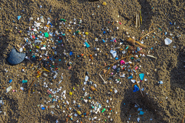 Micro plastics mixed in the sand of the beach