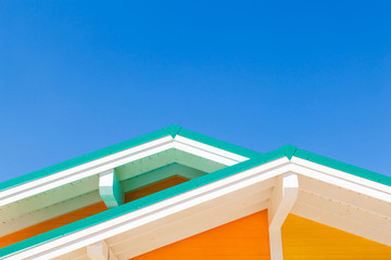 Colourful rooftops on blue sky background